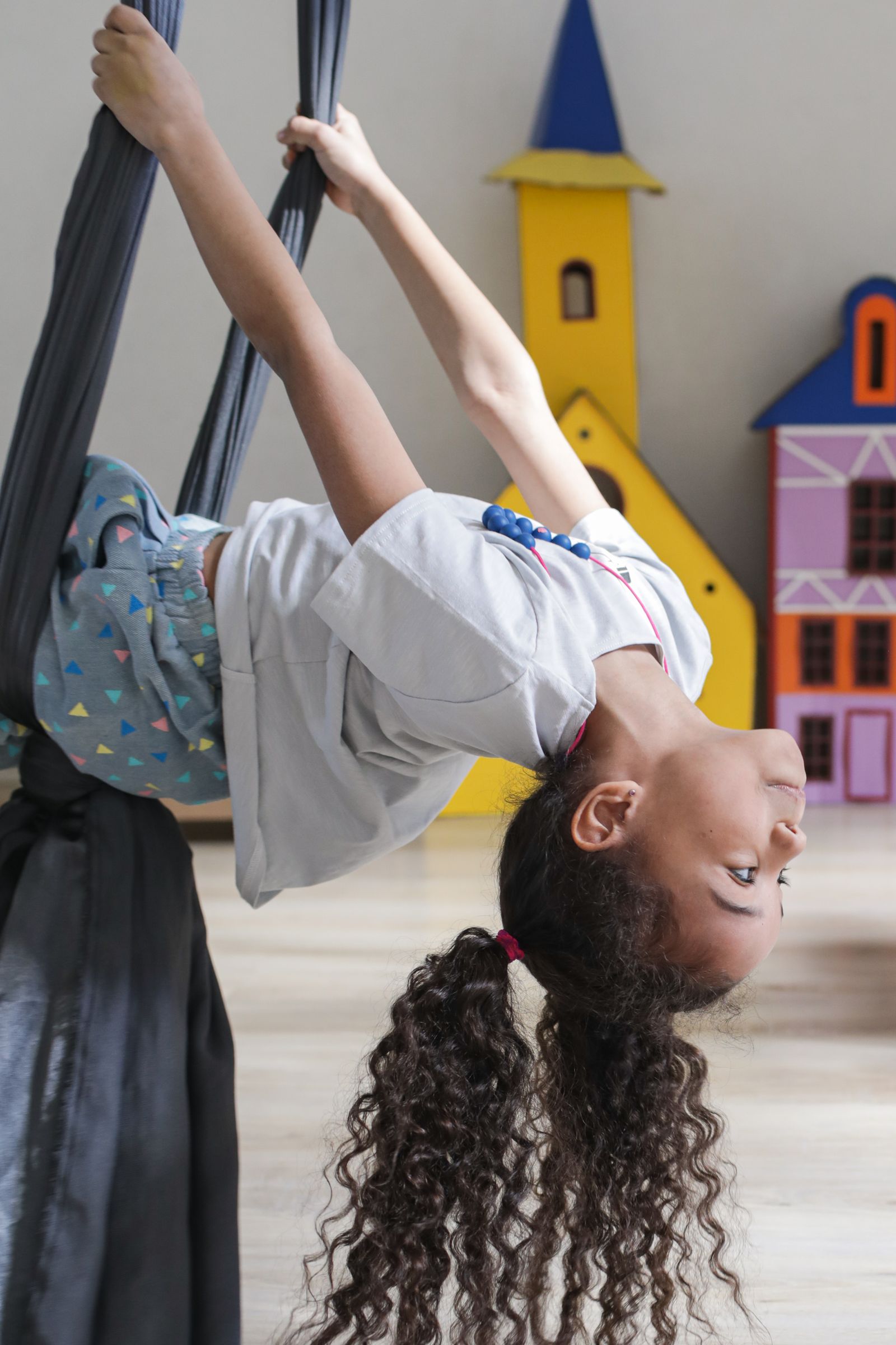 A child enjoying a sensory swing